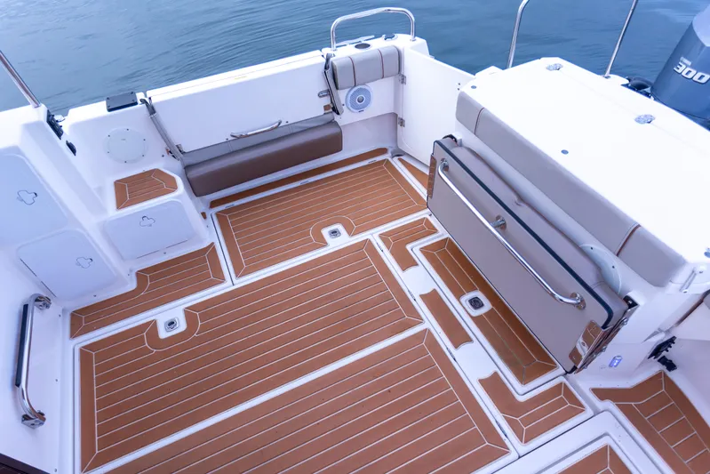  Yacht Photos Pics 2021 Cutwater C-32 CB boat deck with teak flooring and seating area.