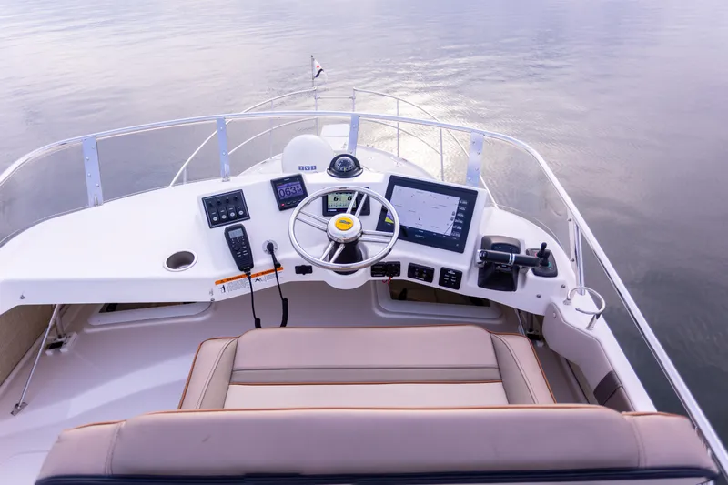 Yacht Photos Pics 2021 Cutwater C-32 CB helm with modern navigation equipment and comfortable seating.