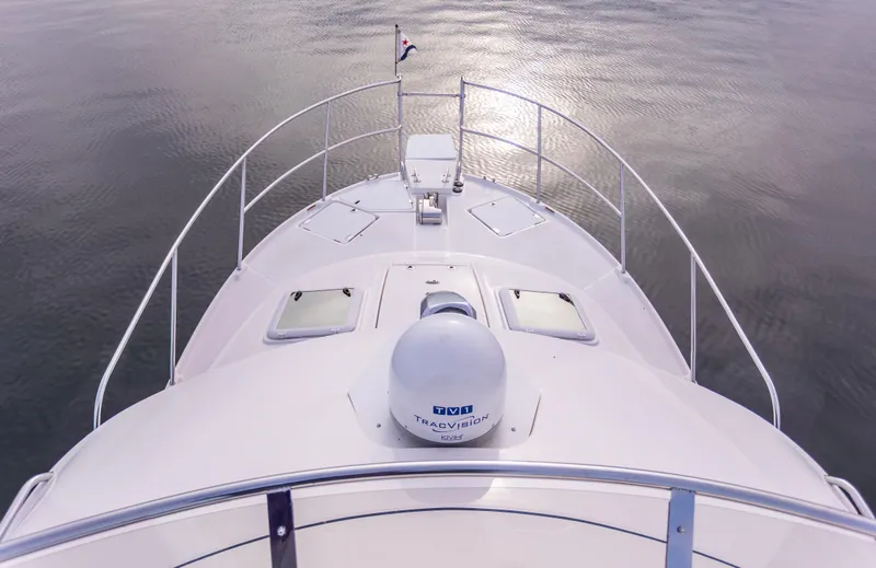  Yacht Photos Pics 2021 Cutwater C-32 CB boat bow view on calm water.