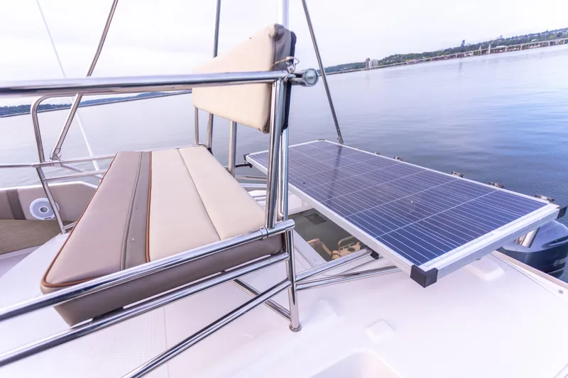  Yacht Photos Pics 2021 Cutwater C-32 CB boat with solar panel and seating, on calm water.