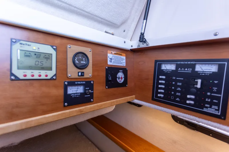  Yacht Photos Pics Control panel of a 2021 Cutwater C-32 CB boat with various gauges and switches.