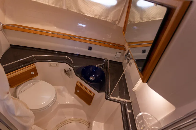  Yacht Photos Pics 2021 Cutwater C-32 CB boat bathroom with modern fixtures and compact design.