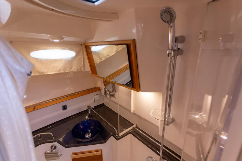  Yacht Photos Pics 2021 Cutwater C-32 CB boat bathroom with shower, sink, and mirror.