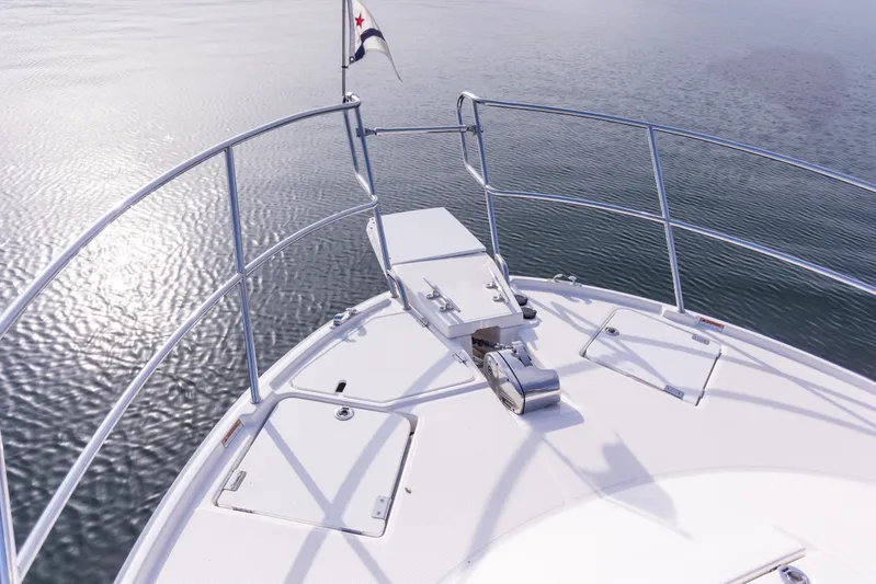  Yacht Photos Pics 2021 Cutwater C-32 CB boat bow with railing and calm water view.
