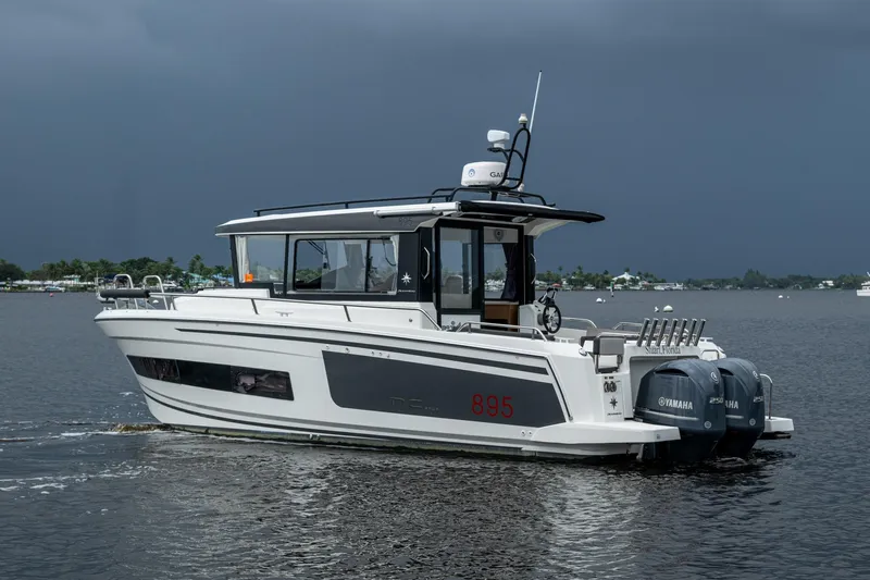  Yacht Photos Pics 2021 Jeanneau NC Sport 895 boat on water with twin Yamaha engines.
