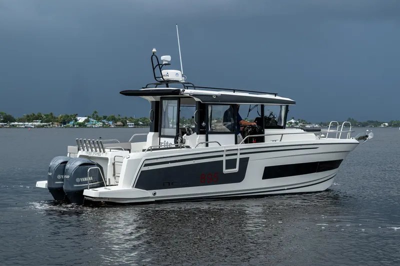  Yacht Photos Pics 2021 Jeanneau NC Sport 895 boat on calm water with Yamaha engines.