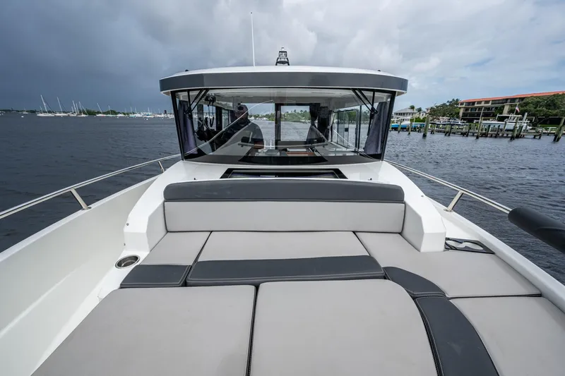  Yacht Photos Pics 2021 Jeanneau NC Sport 895 boat with spacious deck and modern design on the water.