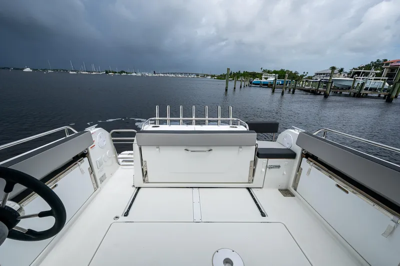  Yacht Photos Pics 2021 Jeanneau NC Sport 895 boat interior with scenic marina view.