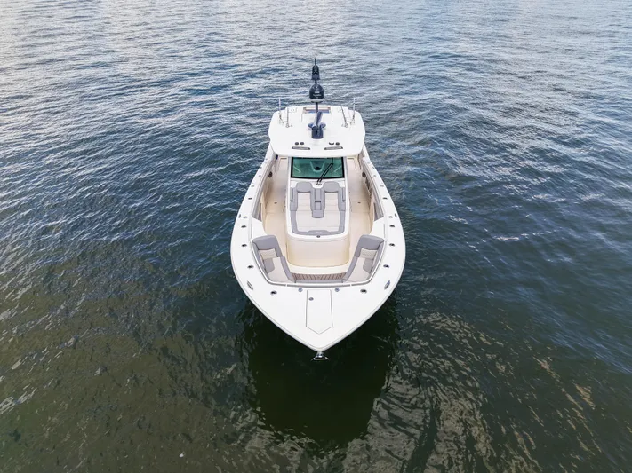 Lucky 24 II Yacht Photos Pics 2023 Scout 400 LXF boat on calm water, aerial view.