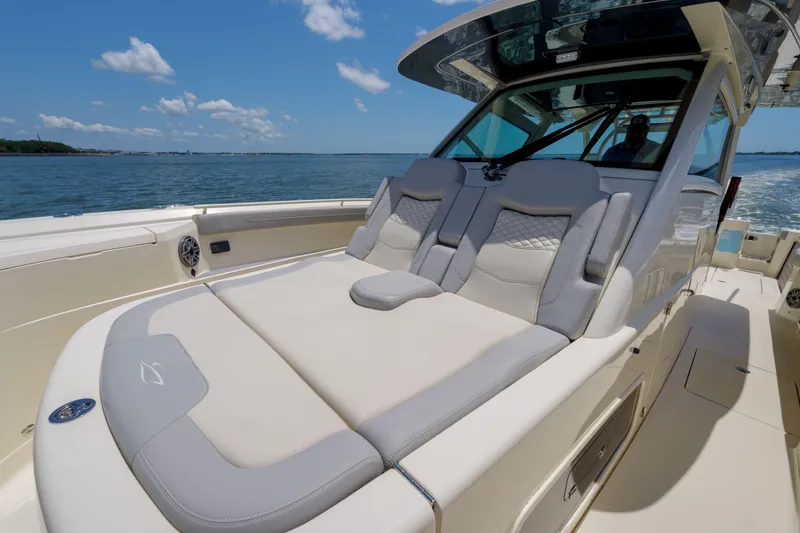 Lucky 24 II Yacht Photos Pics 2023 Scout 400 LXF luxury boat with spacious seating on open water.