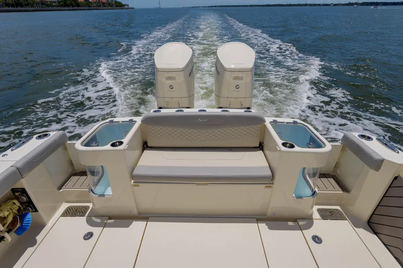 Lucky 24 II Yacht Photos Pics 2023 Scout 400 LXF boat with dual engines cruising on open water.