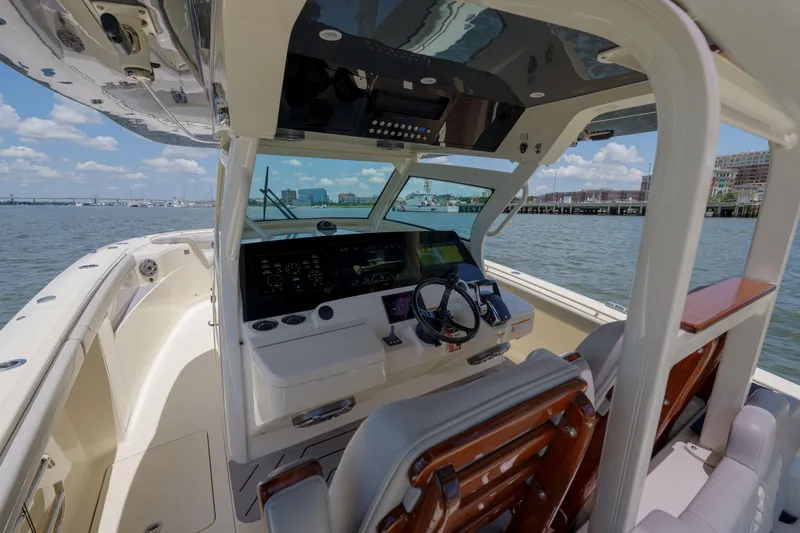 Lucky 24 II Yacht Photos Pics 2023 Scout 400 LXF boat interior with advanced navigation system on a sunny day.