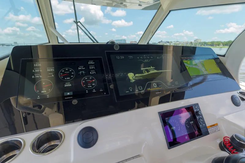 Lucky 24 II Yacht Photos Pics 2023 Scout 400 LXF boat dashboard with advanced navigation displays and controls.