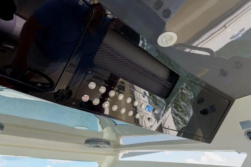 Lucky 24 II Yacht Photos Pics 2023 Scout 400 LXF boat dashboard with control panel and buttons.