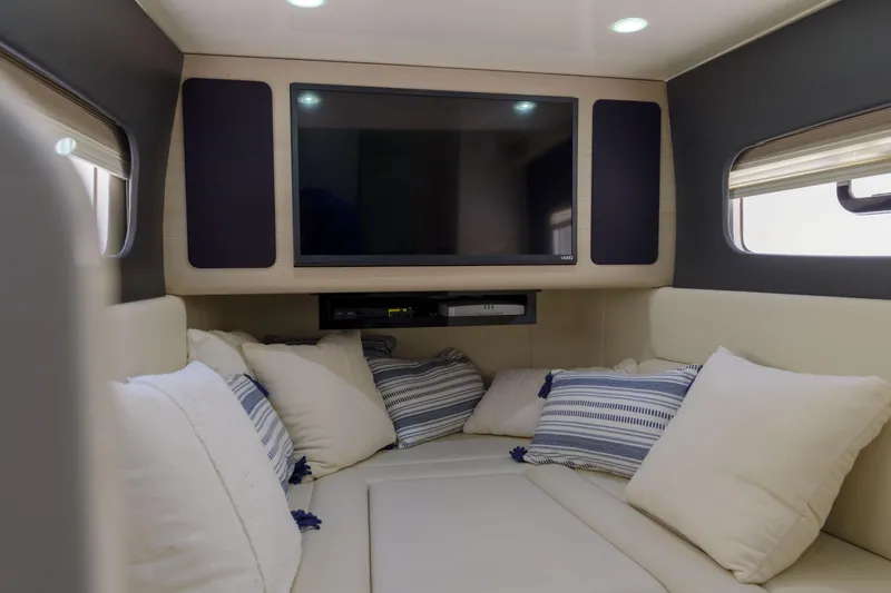 Lucky 24 II Yacht Photos Pics Luxurious interior of 2023 Scout 400 LXF boat with cozy seating and TV.