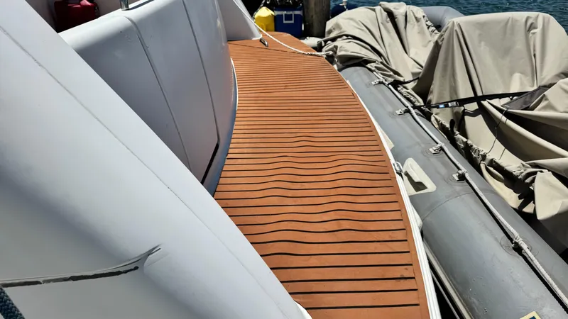  Yacht Photos Pics 1996 Carver 500 Cockpit Motor Yacht with teak deck and covered inflatable boat.