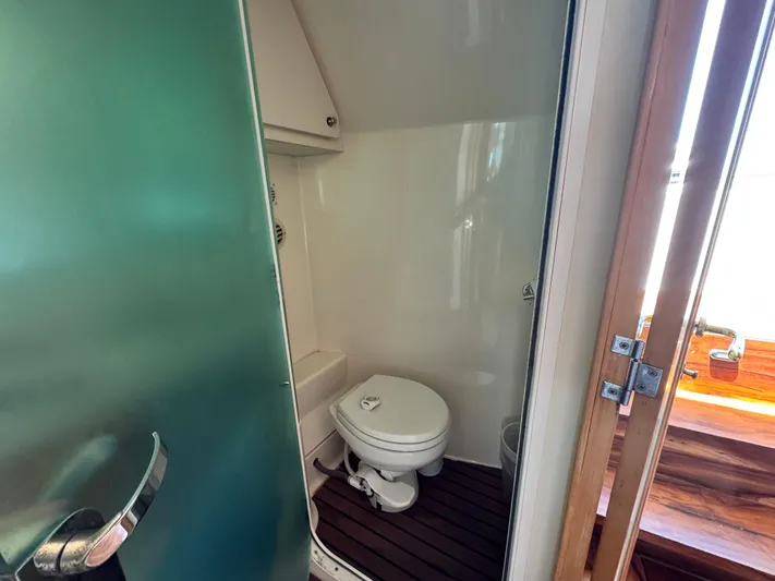  Yacht Photos Pics Bathroom interior of 1996 Carver 500 Cockpit Motor Yacht with wooden flooring.