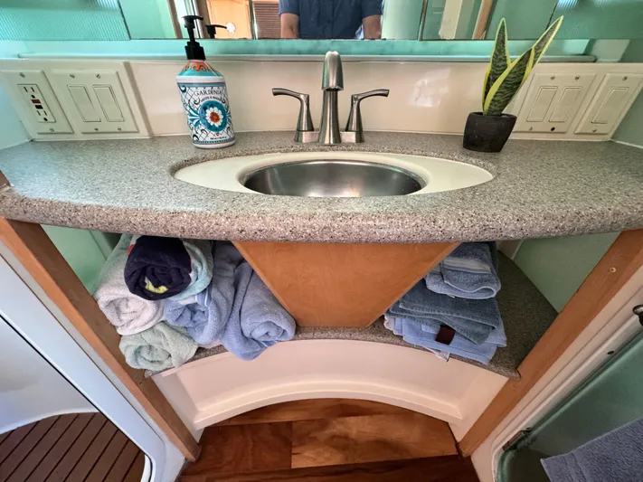  Yacht Photos Pics Bathroom sink area in a 1996 Carver 500 Cockpit Motor Yacht with towels and decor.