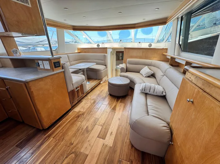  Yacht Photos Pics Luxurious interior of 1996 Carver 500 Cockpit Motor Yacht with plush seating and wood flooring.