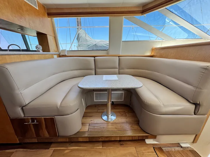  Yacht Photos Pics Luxurious interior of 1996 Carver 500 Cockpit Motor Yacht with plush seating and table.