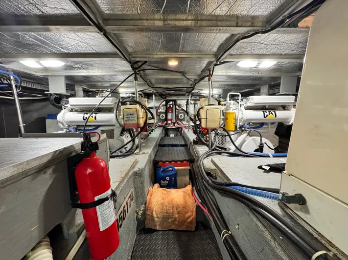 Yacht Photos Pics Engine room of 1996 Carver 500 Cockpit Motor Yacht with CAT engines and fire extinguisher.