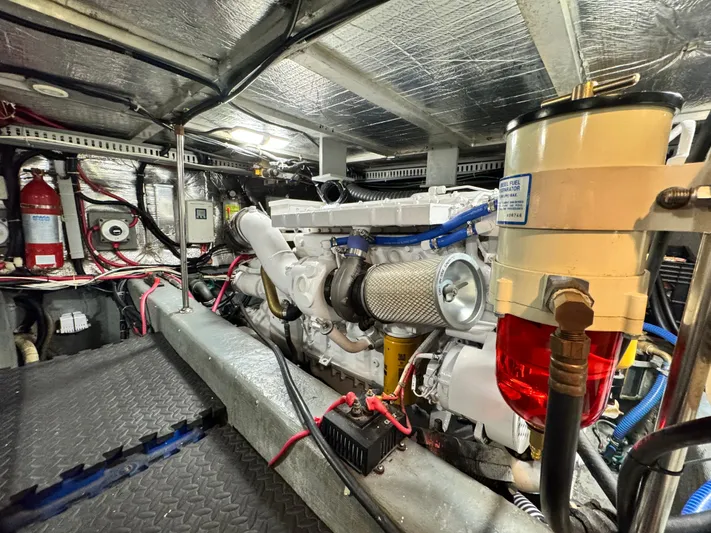  Yacht Photos Pics Engine room of a 1996 Carver 500 Cockpit Motor Yacht, showcasing machinery and wiring.