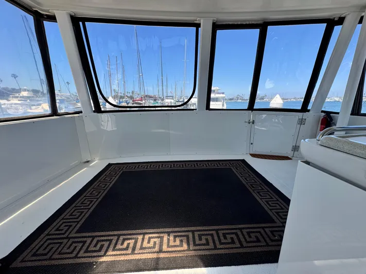  Yacht Photos Pics Interior view of 1996 Carver 500 Cockpit Motor Yacht with marina backdrop.