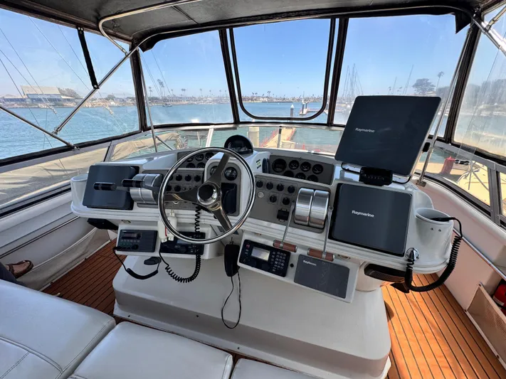  Yacht Photos Pics 1996 Carver 500 Cockpit Motor Yacht helm with navigation equipment and panoramic marina view.