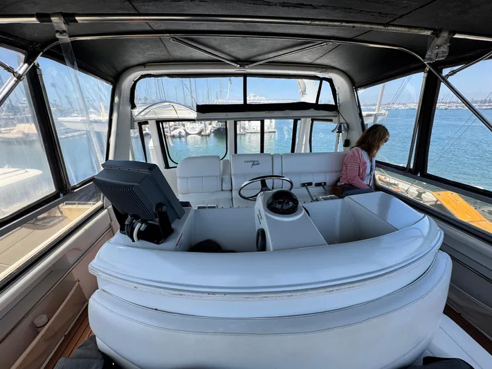  Yacht Photos Pics 1996 Carver 500 Cockpit Motor Yacht interior with helm, seating, and marina view.