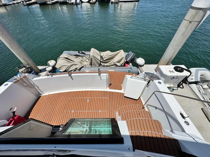  Yacht Photos Pics 1996 Carver 500 Cockpit Motor Yacht docked, featuring spacious wooden deck and marina view.