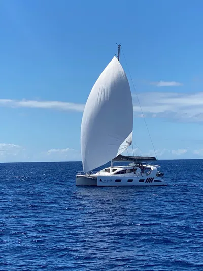 Levante Yacht Photos Pics 2022 Xquisite Yachts X5 PLUS sailing on open ocean under clear blue sky.