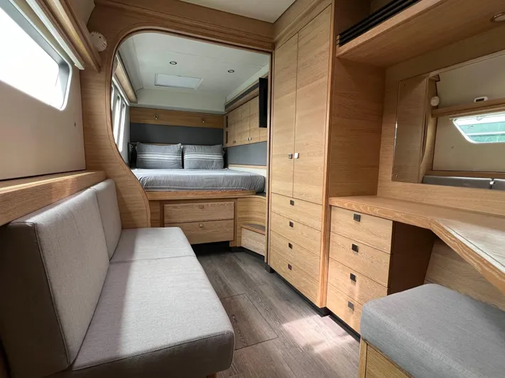 Levante Yacht Photos Pics Luxurious interior of 2022 Xquisite Yachts X5 PLUS with modern wood finish and cozy seating.