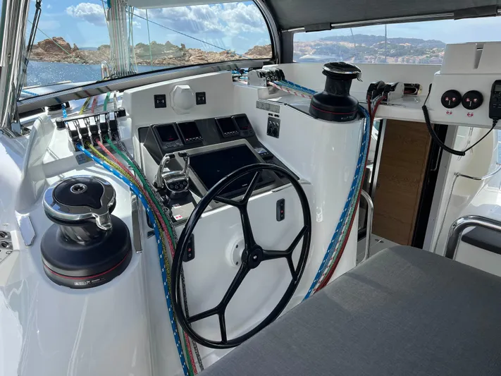 Levante Yacht Photos Pics Cockpit of 2022 Xquisite Yachts X5 PLUS with steering wheel and control panel.