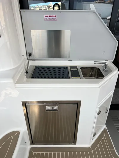 Levante Yacht Photos Pics Outdoor kitchenette on 2022 Xquisite Yachts X5 PLUS with sink and grill.