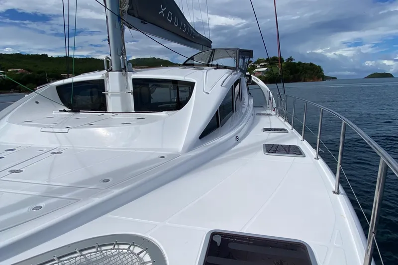 Levante Yacht Photos Pics 2022 Xquisite Yachts X5 PLUS sailing on calm waters under a cloudy sky.