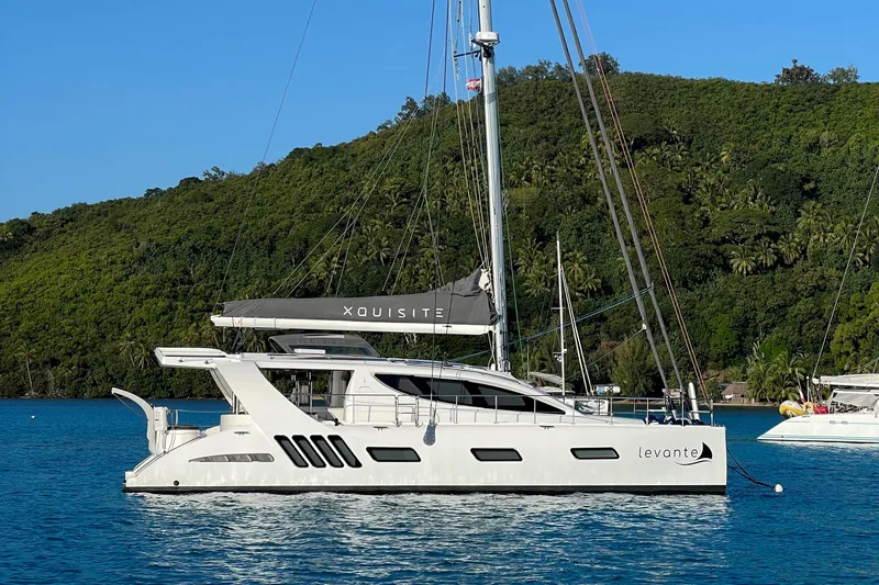Levante Yacht Photos Pics 2022 Xquisite Yachts X5 PLUS catamaran sailing on a serene blue sea.