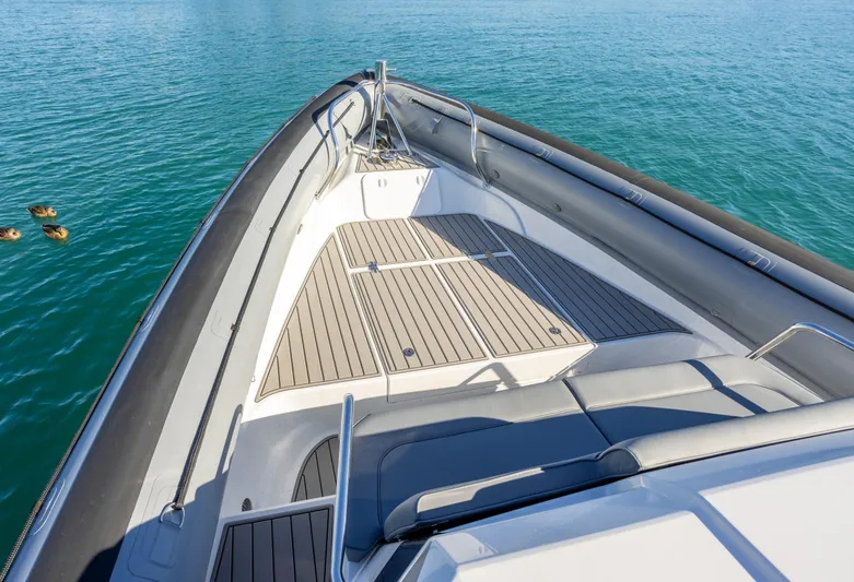  Yacht Photos Pics 2025 Protector 380 Targa boat deck with sleek design on calm blue water.