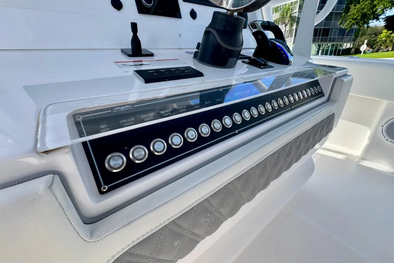 All Eyez On Me Yacht Photos Pics 2024 Invincible 39 Open Fisherman control panel with modern navigation and lighting switches.