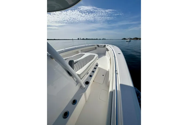 All Eyez On Me Yacht Photos Pics 2024 Invincible 39 Open Fisherman boat on calm water, showcasing sleek design and spacious deck.