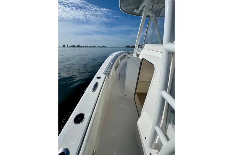 All Eyez On Me Yacht Photos Pics 2024 Invincible 39 Open Fisherman boat on calm water, showcasing sleek design and spacious deck.