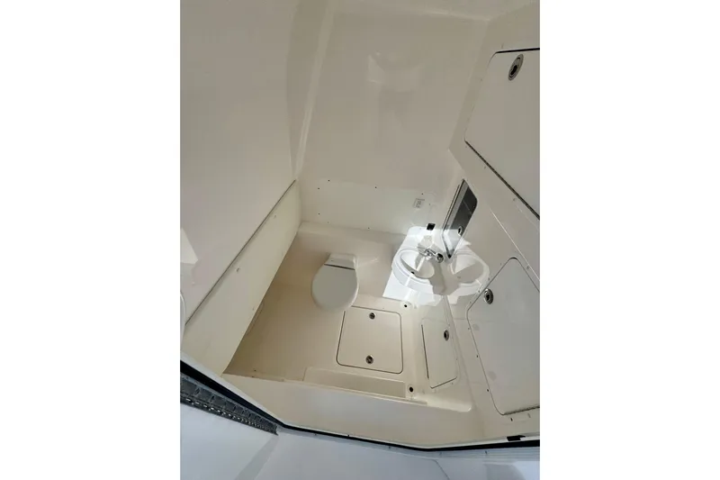 All Eyez On Me Yacht Photos Pics 2024 Invincible 39 Open Fisherman boat interior with toilet and sink.