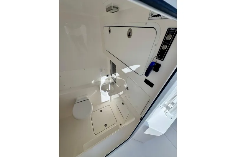 All Eyez On Me Yacht Photos Pics 2024 Invincible 39 Open Fisherman boat interior with toilet and sink.