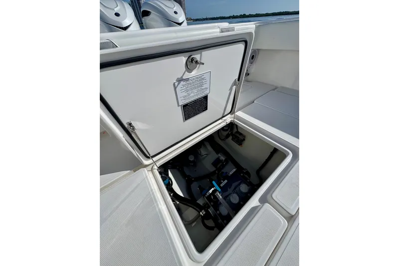 All Eyez On Me Yacht Photos Pics 2024 Invincible 39 Open Fisherman boat hatch open, revealing internal components.