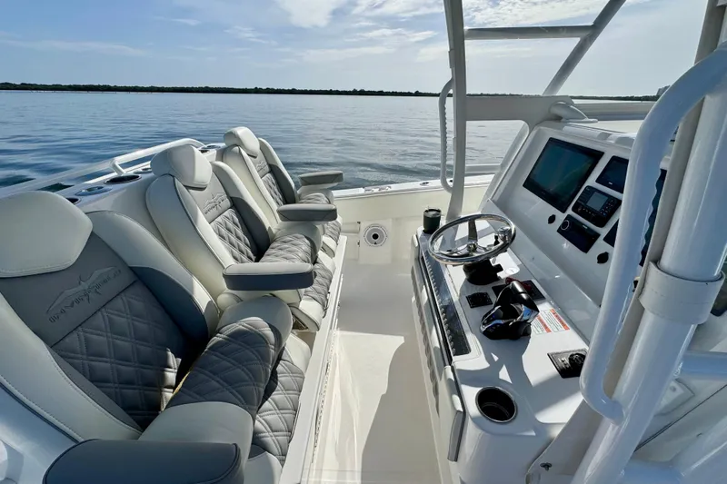 All Eyez On Me Yacht Photos Pics 2024 Invincible 39 Open Fisherman boat interior with luxury seating and modern dashboard.