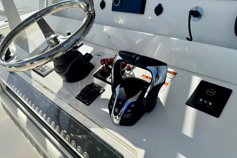 All Eyez On Me Yacht Photos Pics 2024 Invincible 39 Open Fisherman helm with steering wheel and controls.