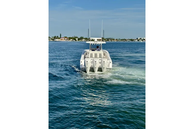 All Eyez On Me Yacht Photos Pics 2024 Invincible 39 Open Fisherman boat cruising on blue ocean waters.