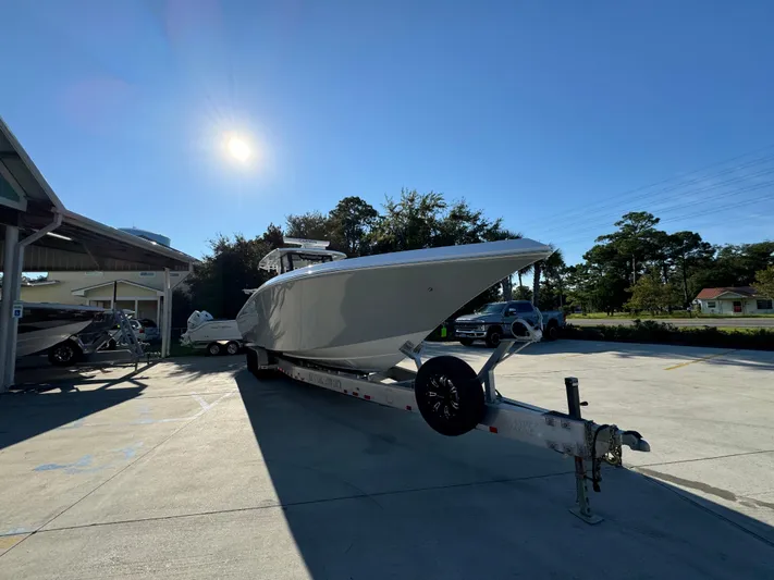 Yacht Photos Pics 2025 Fountain 38TE boat on trailer under clear blue sky.