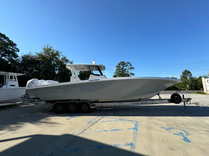 Yacht Photos Pics 2025 Fountain 38TE boat on trailer in sunny outdoor setting.
