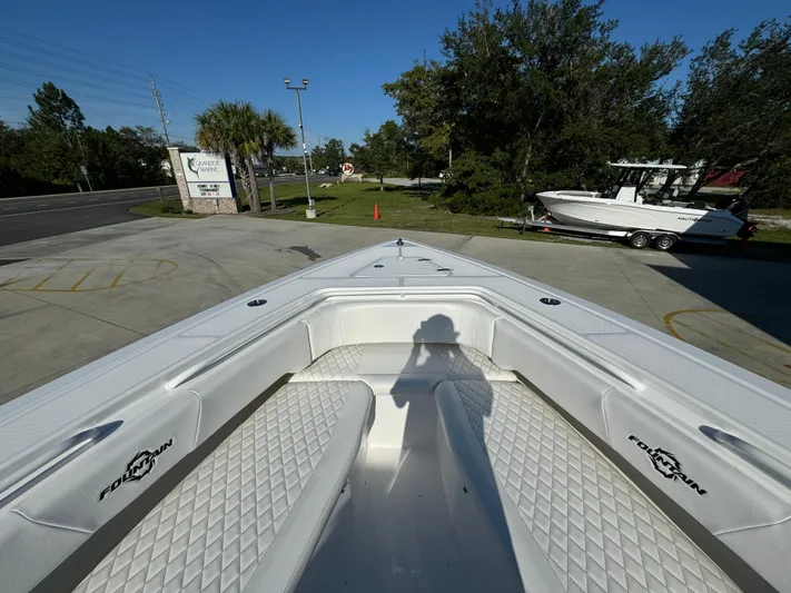  Yacht Photos Pics Bow view of 2025 Fountain 38TE boat with white seating and diamond pattern upholstery.