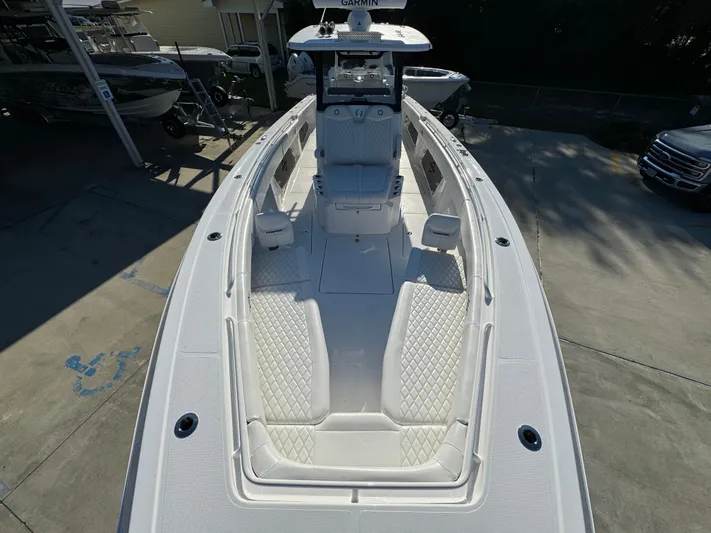  Yacht Photos Pics 2025 Fountain 38TE boat with sleek white design and spacious deck layout.